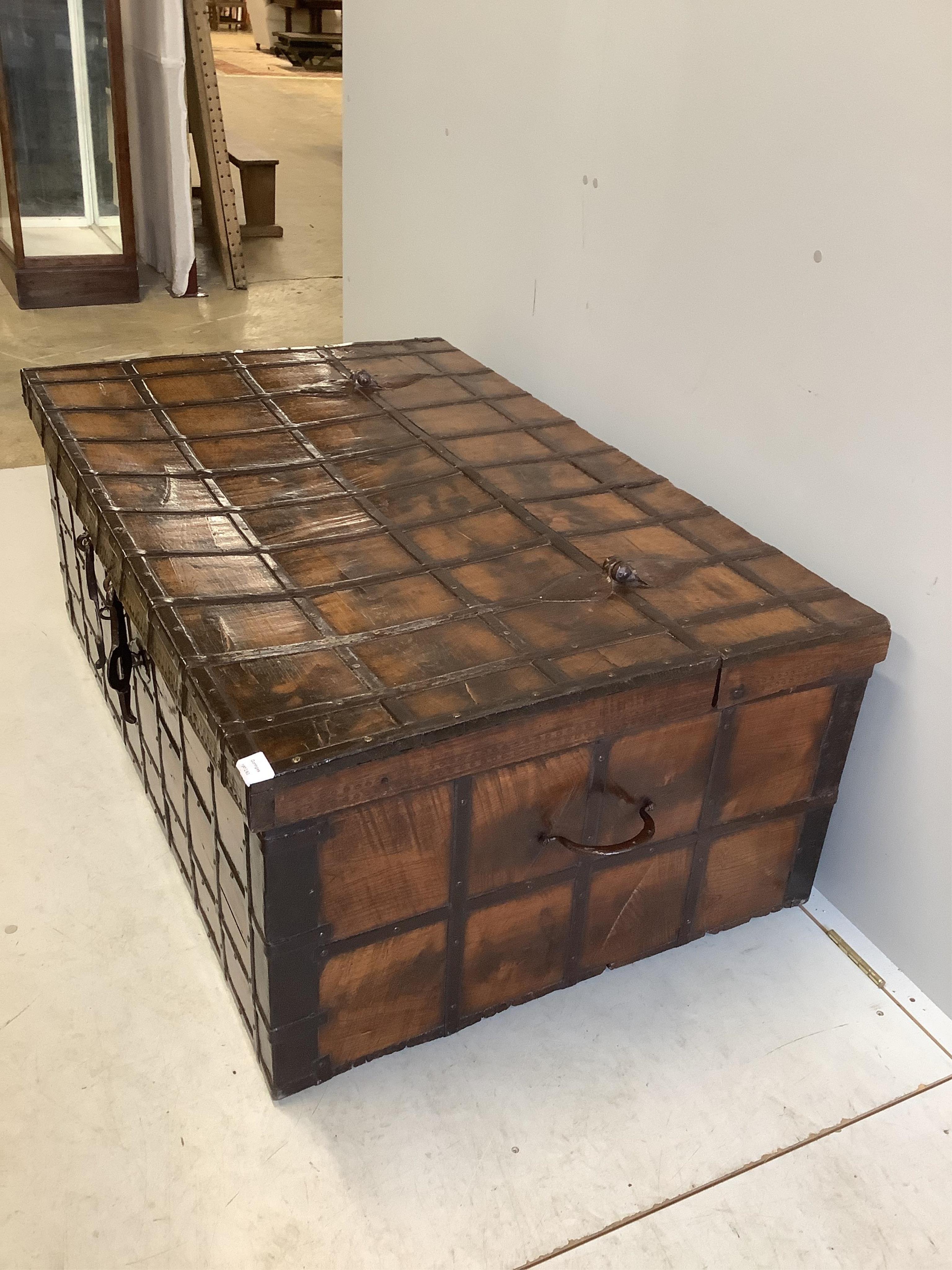 A Spanish wrought iron bound chestnut chest, width 134cm, depth 86cm, height 52cm. Condition - fair to good